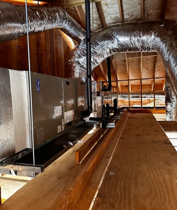 Attic HVAC unit with insulated flexible ductwork